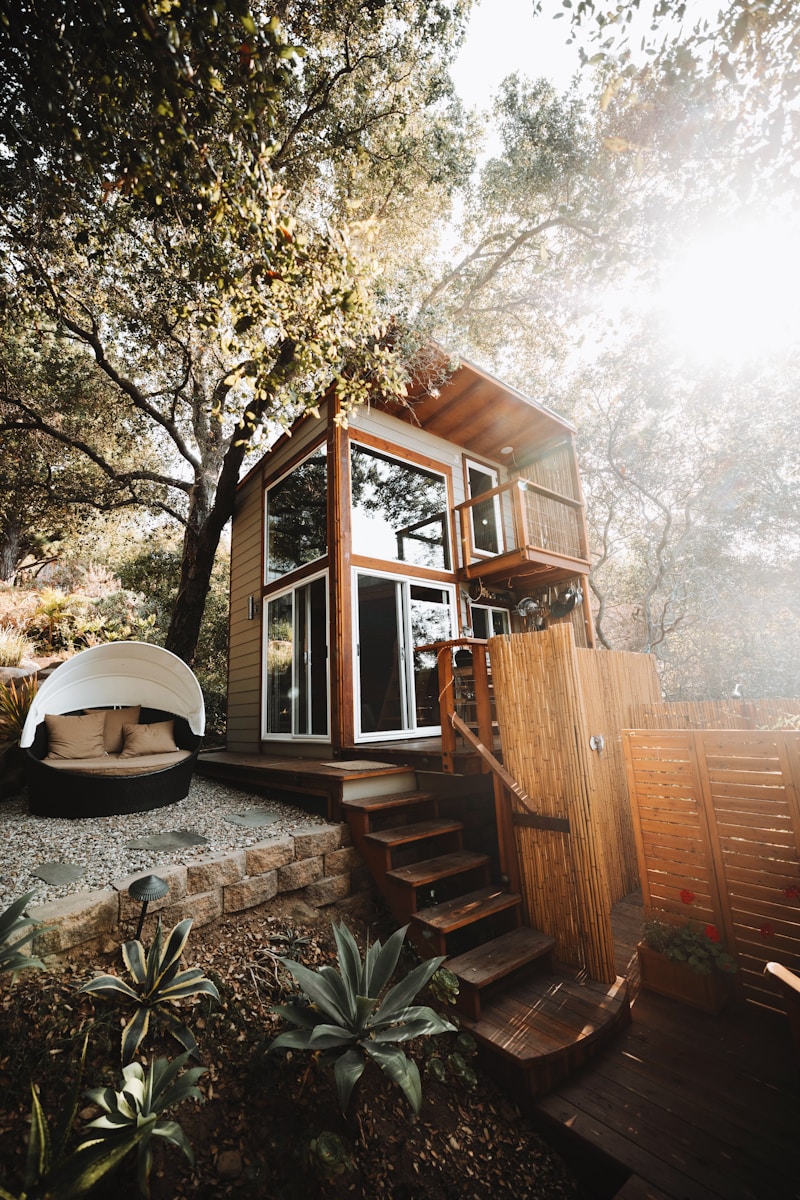 nuit insolite week end brown wooden house near trees during daytime